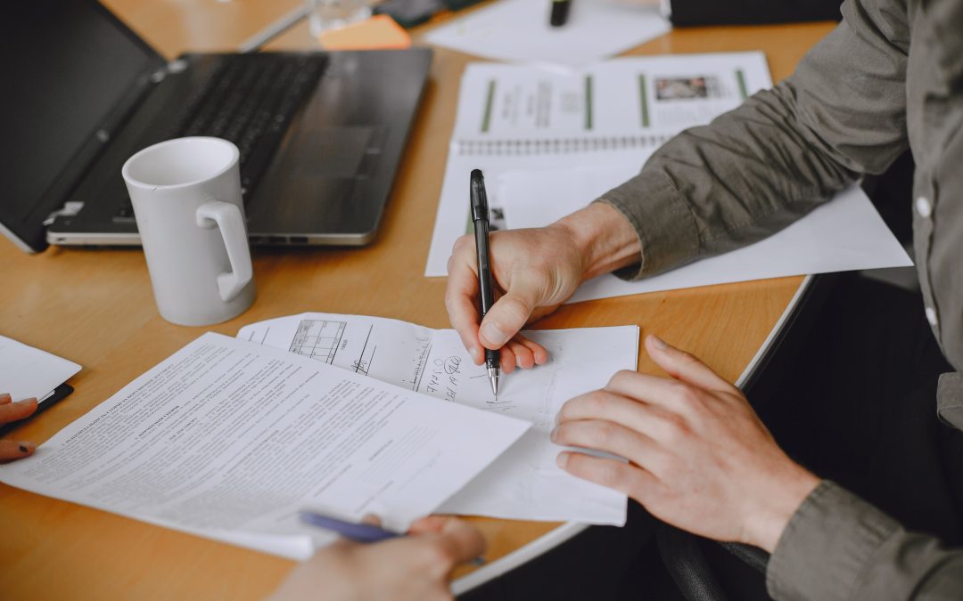 Man signing and reviewing Virginia THC sales law documents