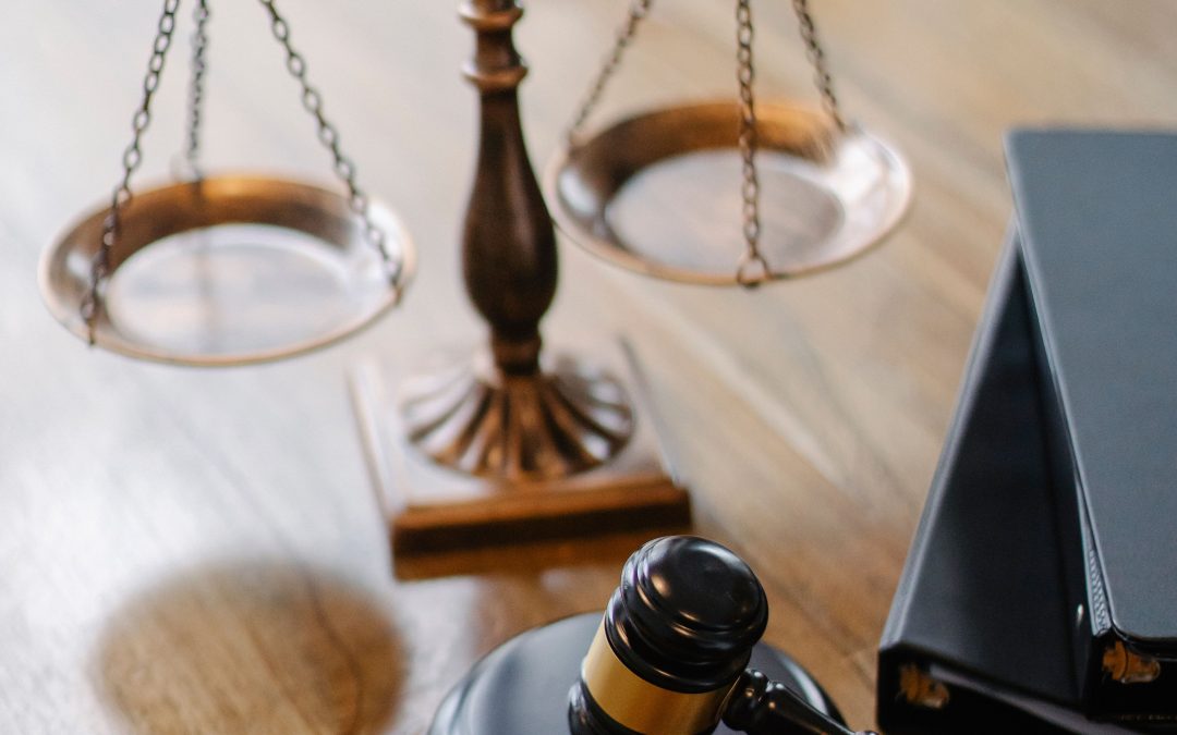 justice scale with gavel next to it